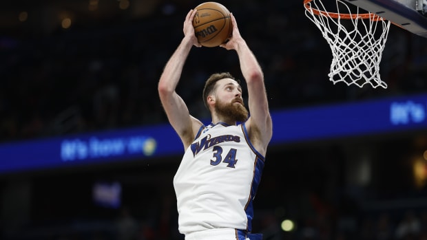 Washington, District of Columbia, USA; Washington Wizards center Jay Huff (34) dunks the ball against the Miami Heat in the fourth quarter in the fourth quarter at Capital One Arena.